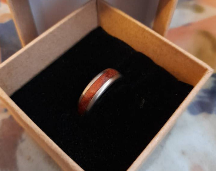 Bubinga wood ring with Titanium core.