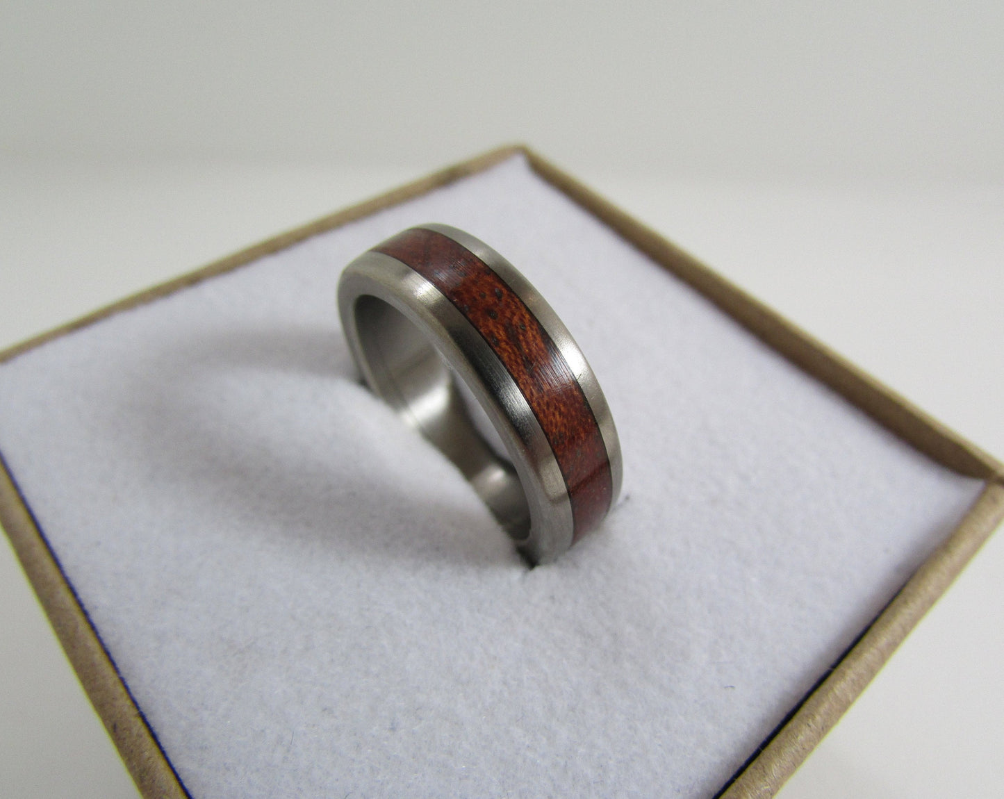 Bubinga wood ring with Titanium core.